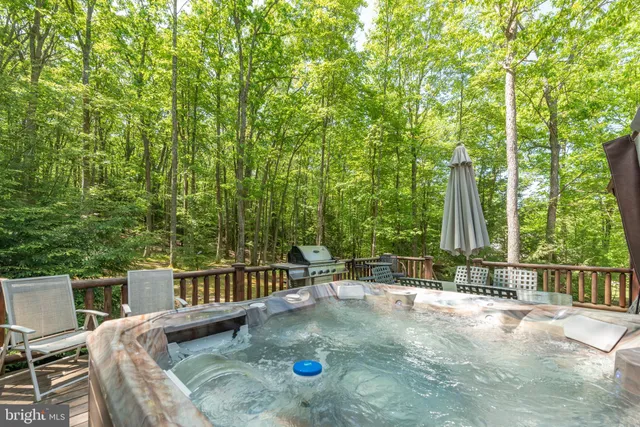 a living room with stainless steel appliances kitchen island granite countertop furniture and a kitchen view
