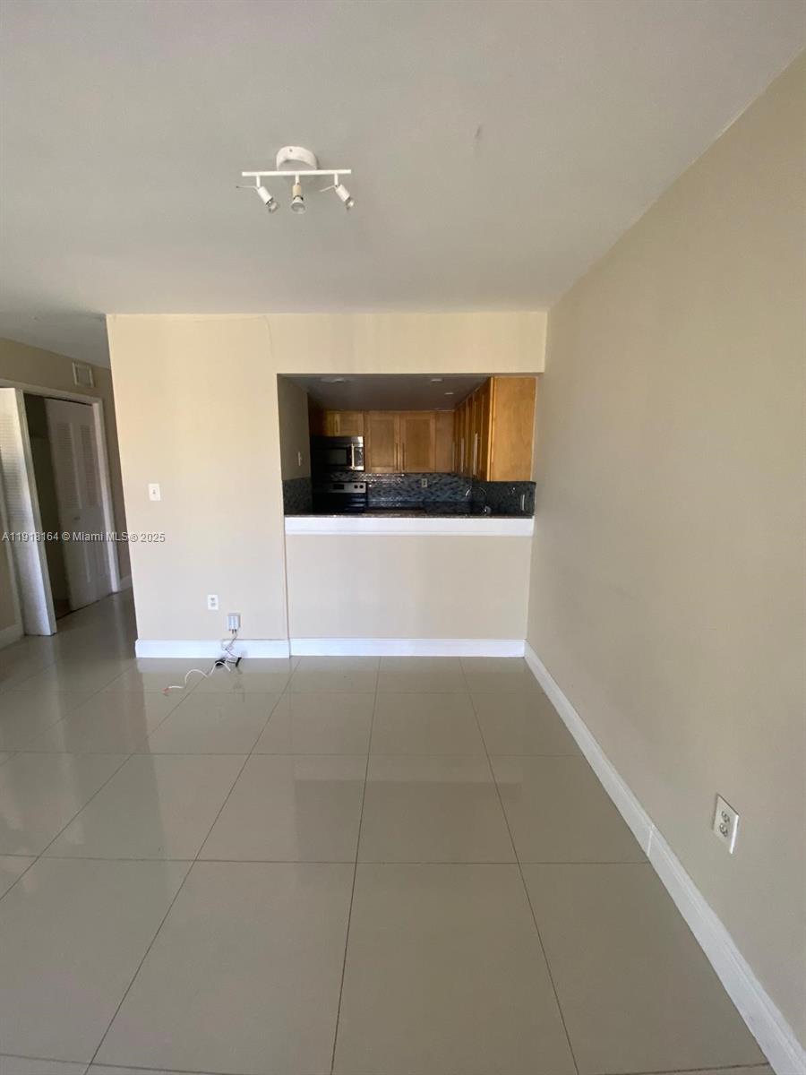 6970 Northwest 186th Street, Unit 3410 Hialeah, FL 33015 - Photo 2 of 10 a view of a livingroom with a staircase