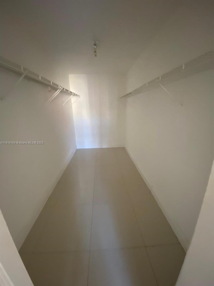 6970 Northwest 186th Street, Unit 3410 Hialeah, FL 33015 - Photo 8 of 10 a view of a room with an empty space