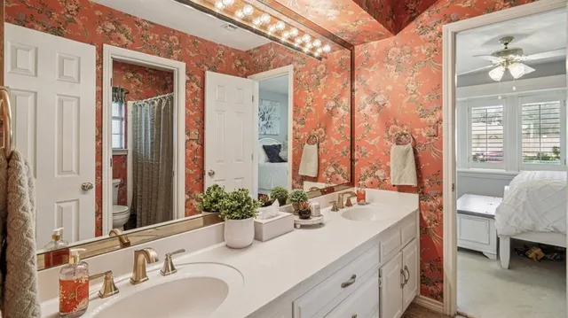a bathroom with a double vanity sink and a mirror