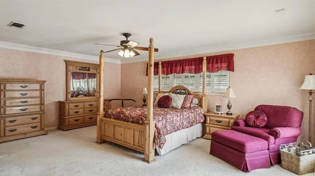 a bedroom with a bed and dresser
