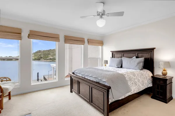 a spacious bedroom with a bed and window