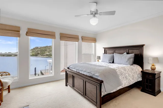 a spacious bedroom with a bed and window