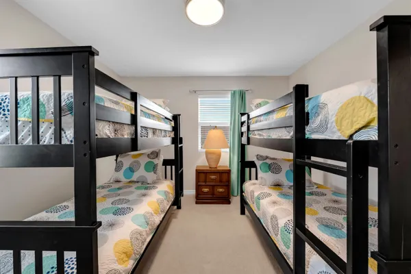 a bedroom with furniture and a window