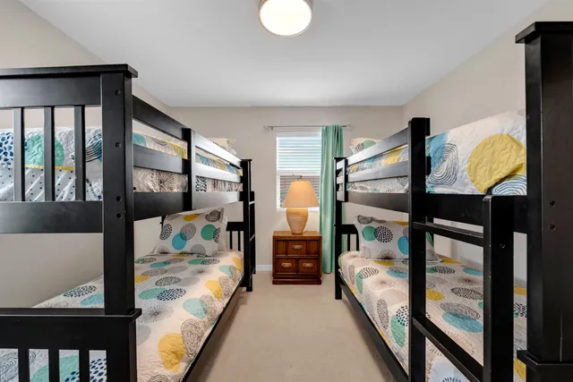 a bedroom with furniture and a window