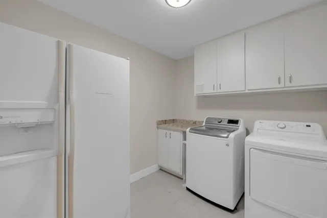 a view of storage and utility room with washer and dryer