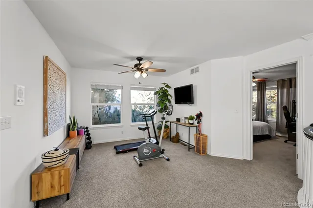 a view of a livingroom with furniture and a flat screen tv