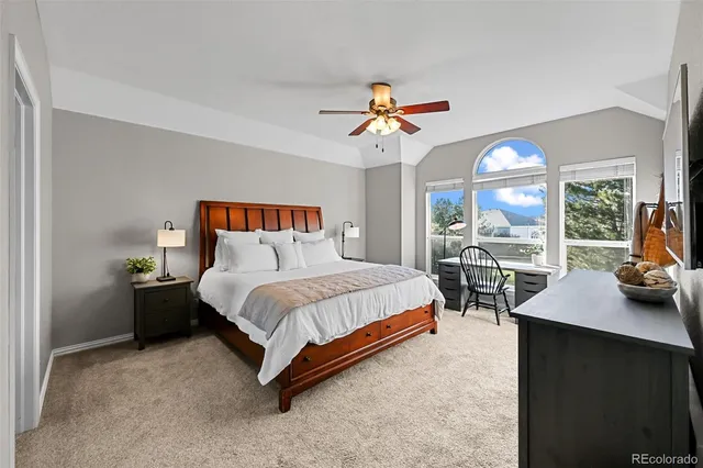 a bed room with a bed and a chair