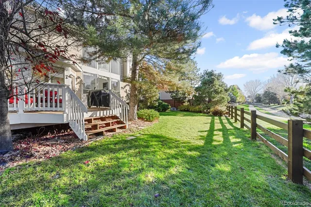 a garden with trees in front of it