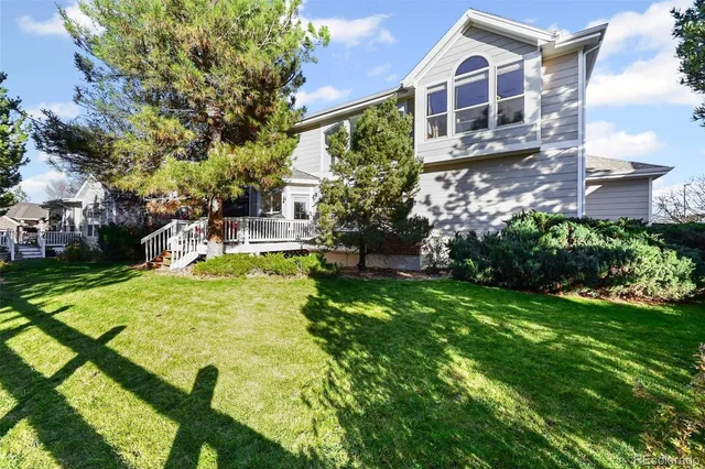 a swimming pool with some trees in the background