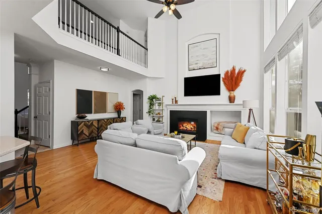 a living room with furniture fireplace and flat screen tv