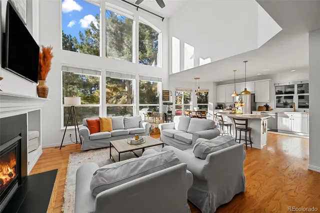 a living room with fireplace furniture and a flat screen tv