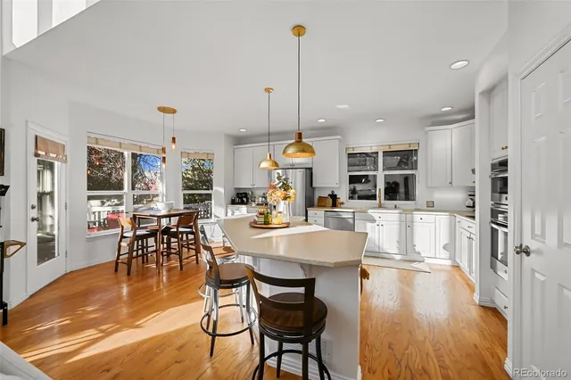 a view of a dining room with furniture window and wooden floor