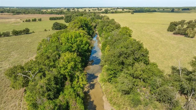 a view of a lake with houses in the back