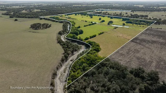 an aerial view of a city with ocean view
