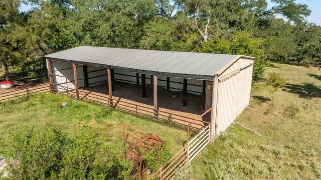 a view of house with yard and entertaining space