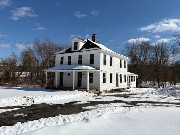 a front view of a house with a yard