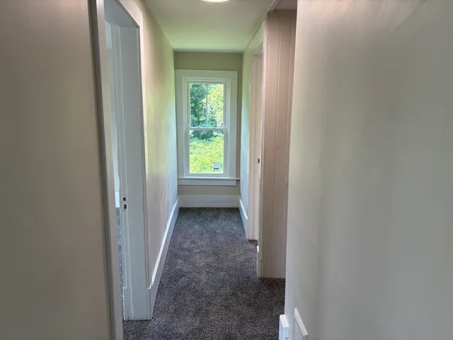 a view of a hallway with a closet