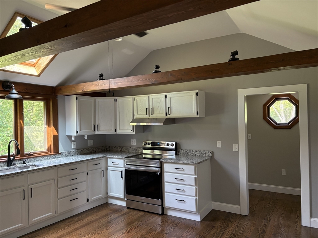 208 Greenfield Road Deerfield, MA 01373 - Photo 5 of 28 a kitchen with granite countertop a refrigerator stove and sink