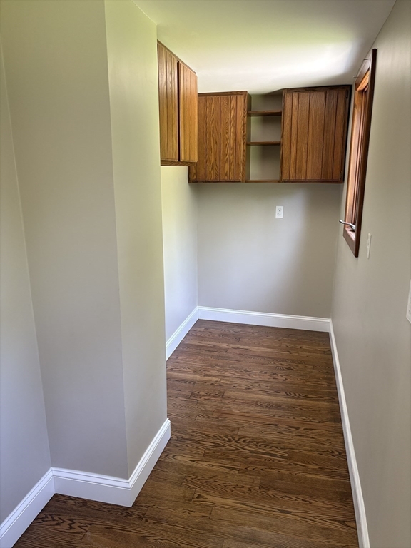 208 Greenfield Road Deerfield, MA 01373 - Photo 7 of 28 a view of an empty room with wooden floor and cabinet