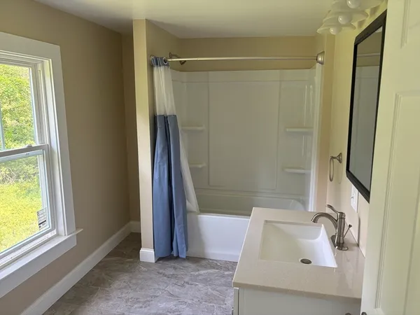 a bathroom with a sink and a tub