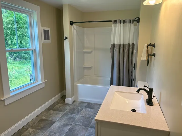 a bathroom with a sink and a tub