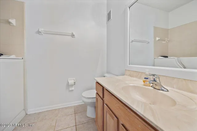 a bathroom with a sink toilet and vanity