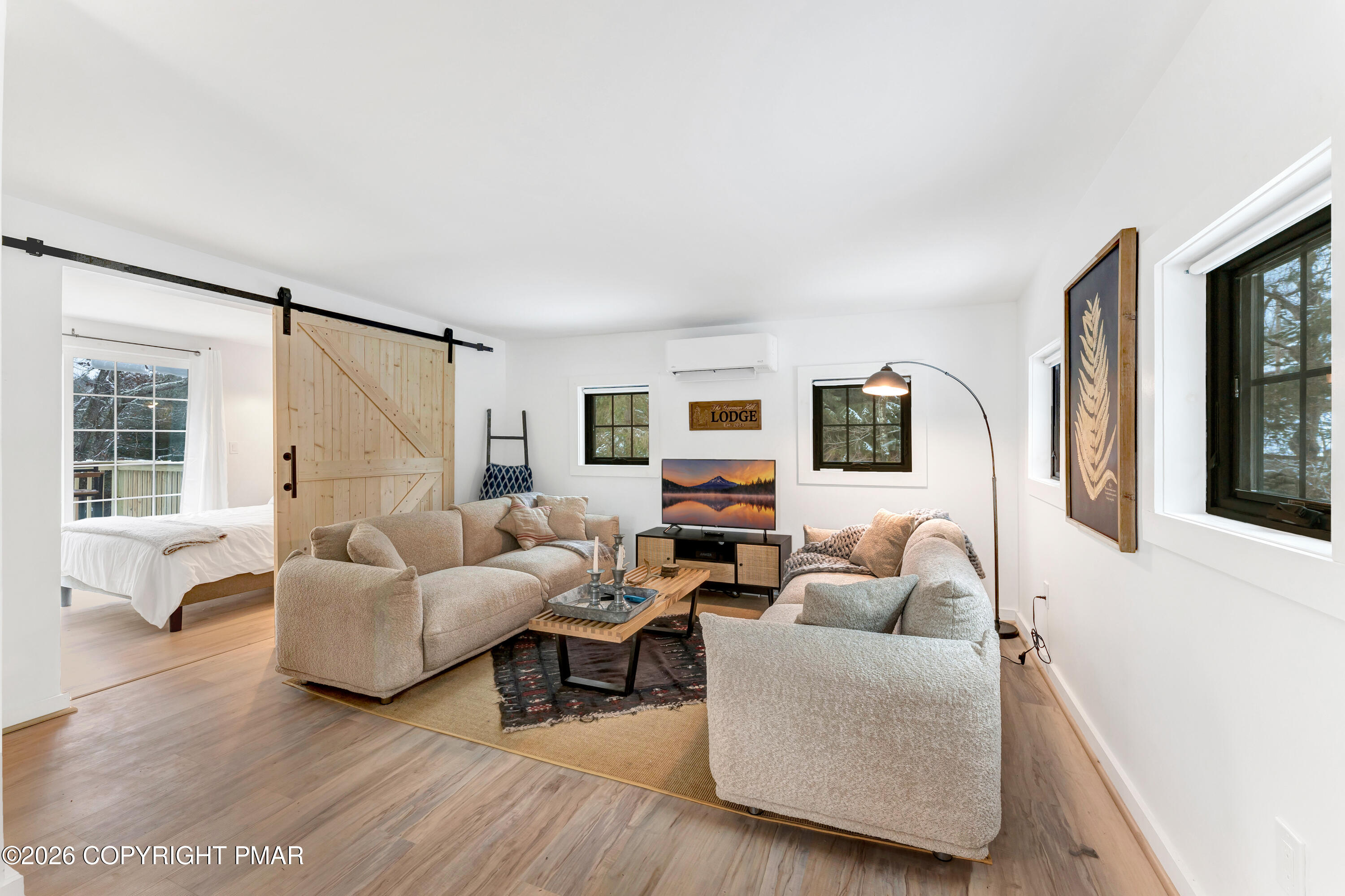 353 German Hill Road Shohola, PA 18458 - Photo 6 of 35 a living room with furniture and a large window