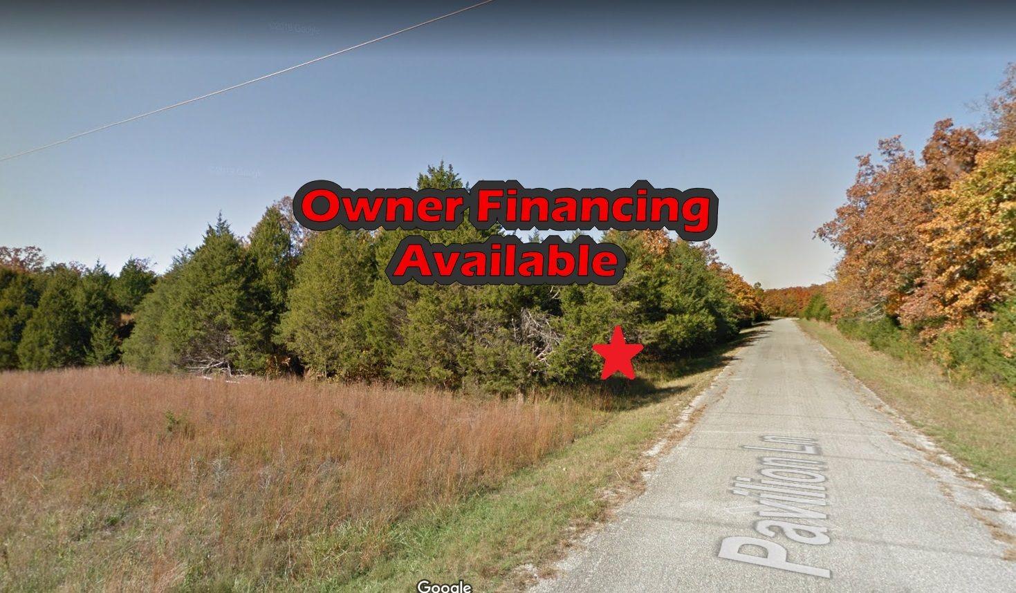 a street sign is sitting on a sidewalk