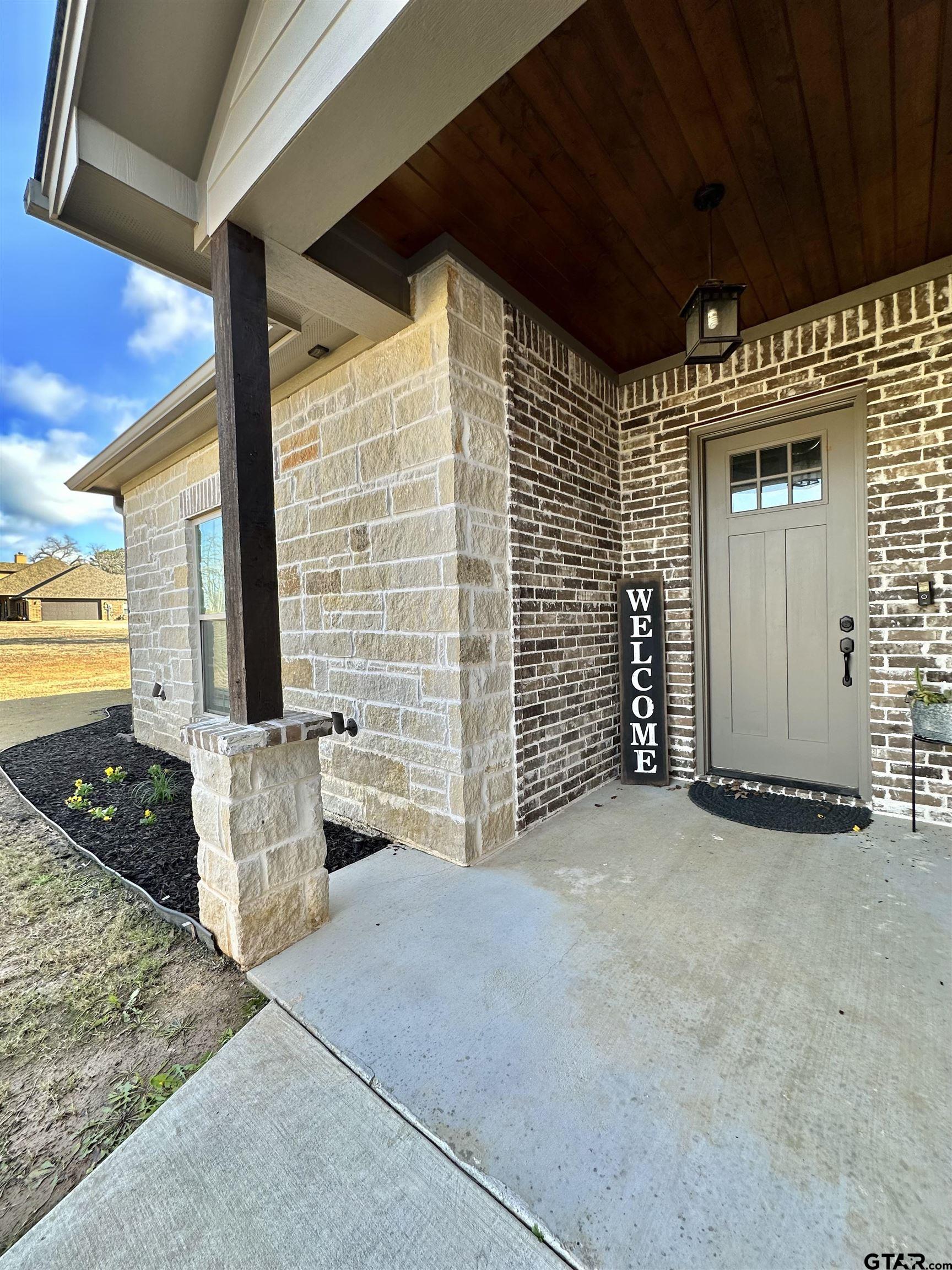 345 Willow Creek Ranch Road Gladewater, TX 75647 - Photo 1 of 47 a view of an entrance to house with yard