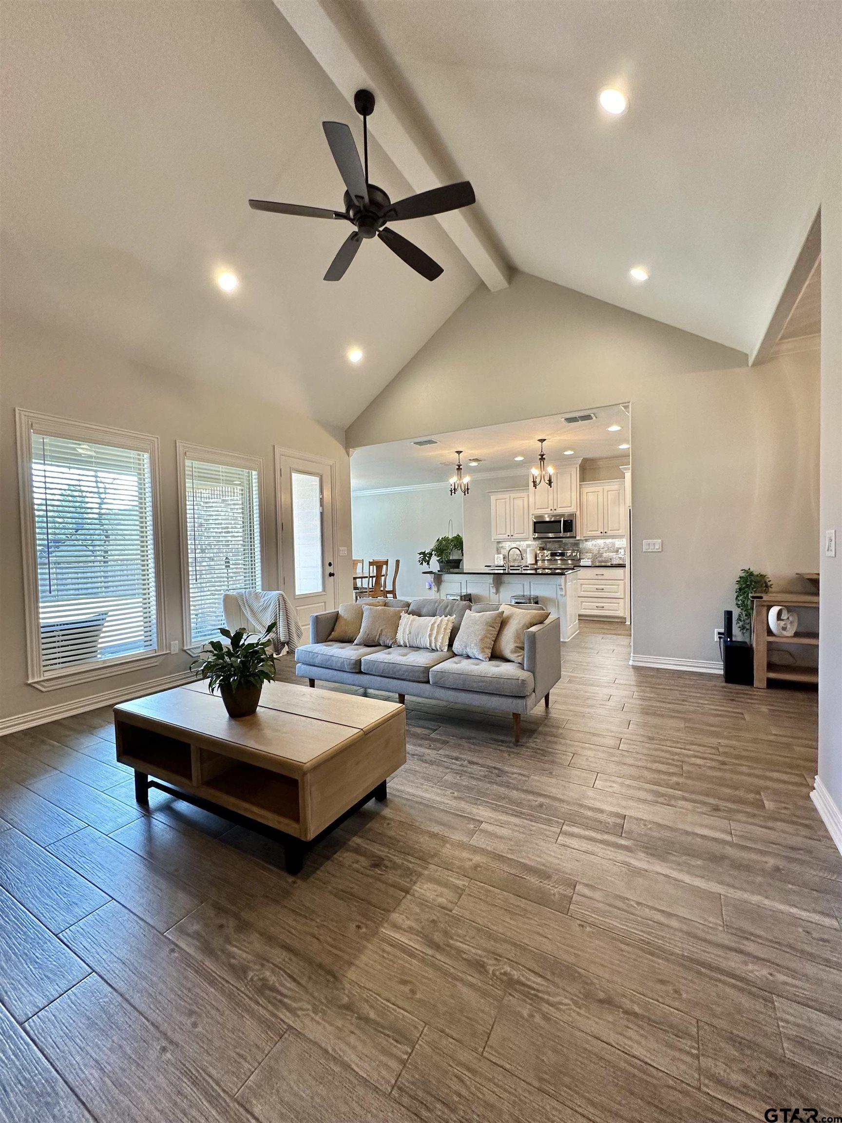 345 Willow Creek Ranch Road Gladewater, TX 75647 - Photo 12 of 47 a living room with furniture and a wooden floor