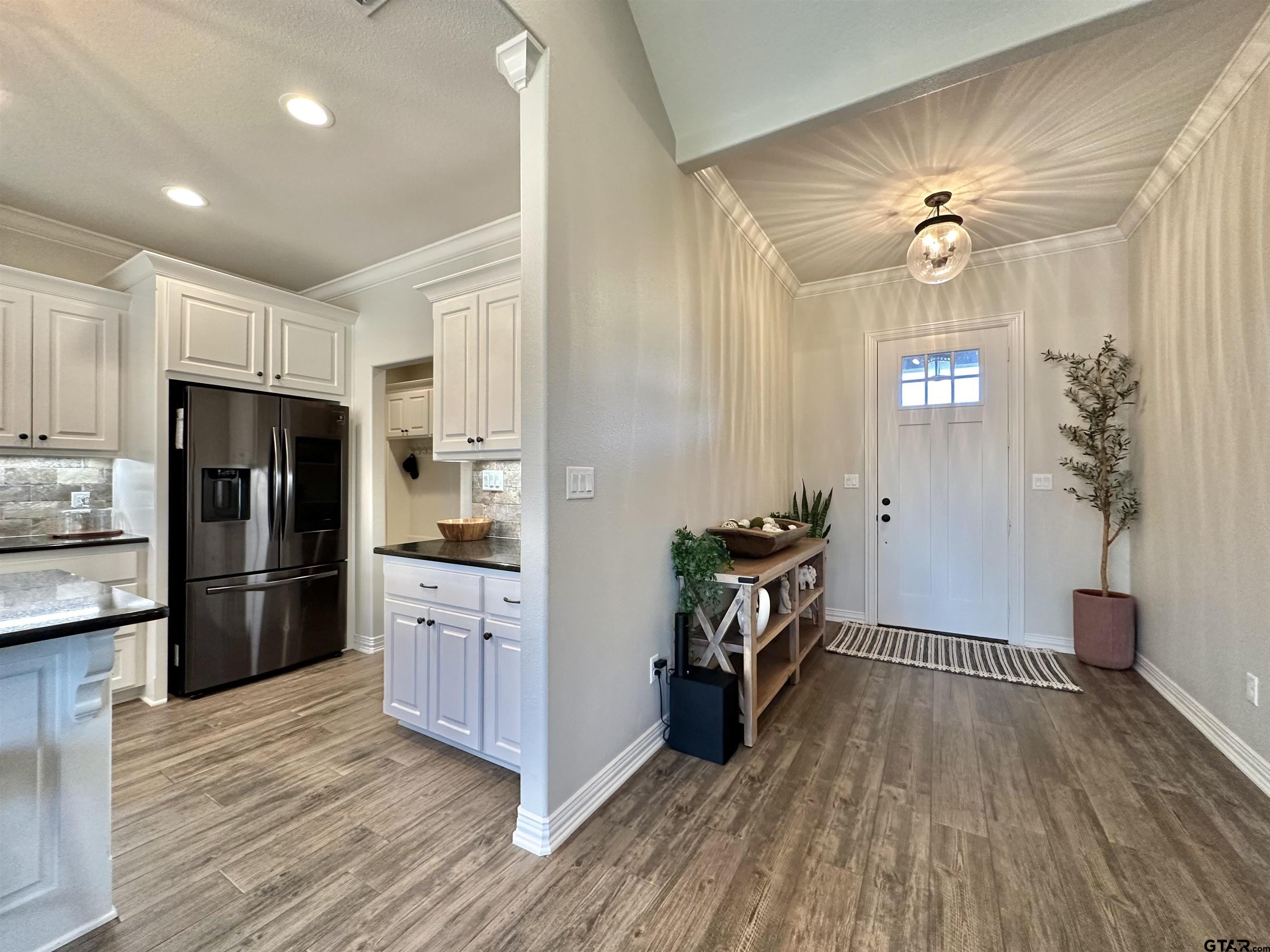 345 Willow Creek Ranch Road Gladewater, TX 75647 - Photo 15 of 47 a kitchen with a refrigerator and a stove