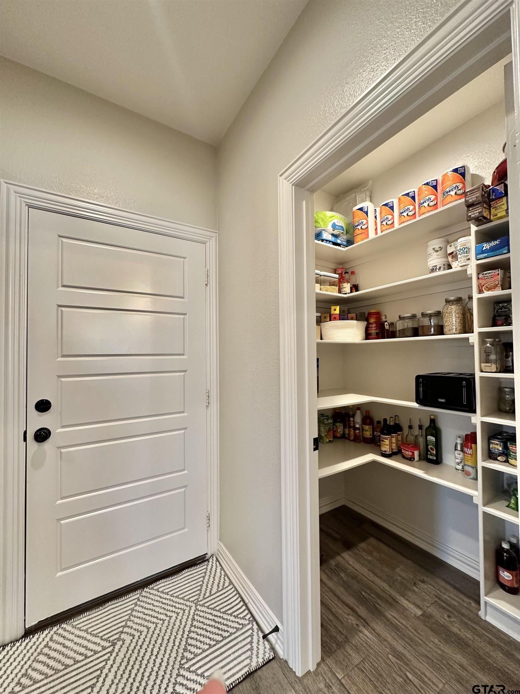 345 Willow Creek Ranch Road Gladewater, TX 75647 - Photo 23 of 47 a view of walk in closet with clothes and shoes