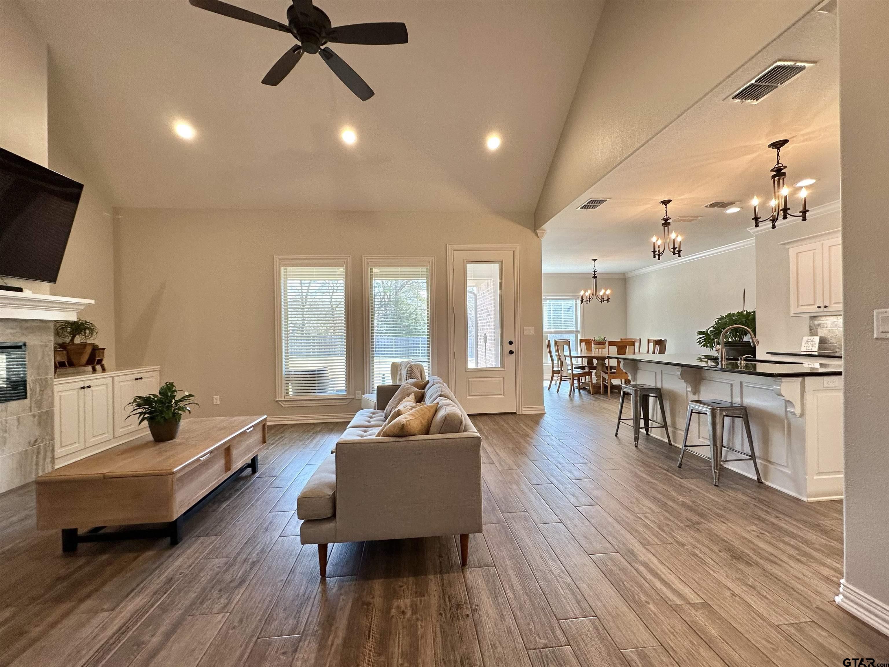 345 Willow Creek Ranch Road Gladewater, TX 75647 - Photo 8 of 47 a living room with furniture and a wooden floor