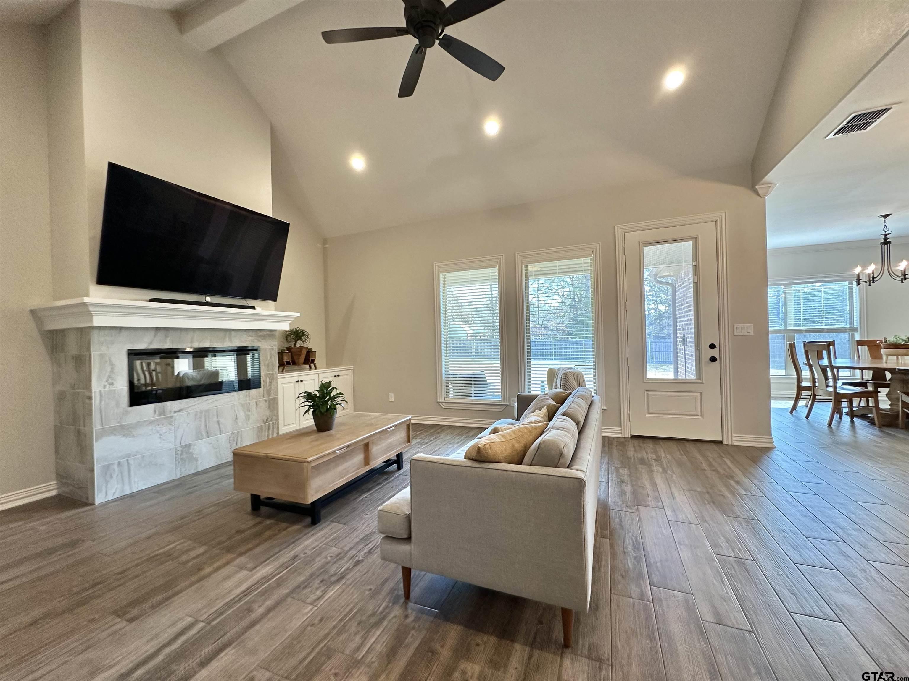 345 Willow Creek Ranch Road Gladewater, TX 75647 - Photo 9 of 47 a living room with furniture and a flat screen tv
