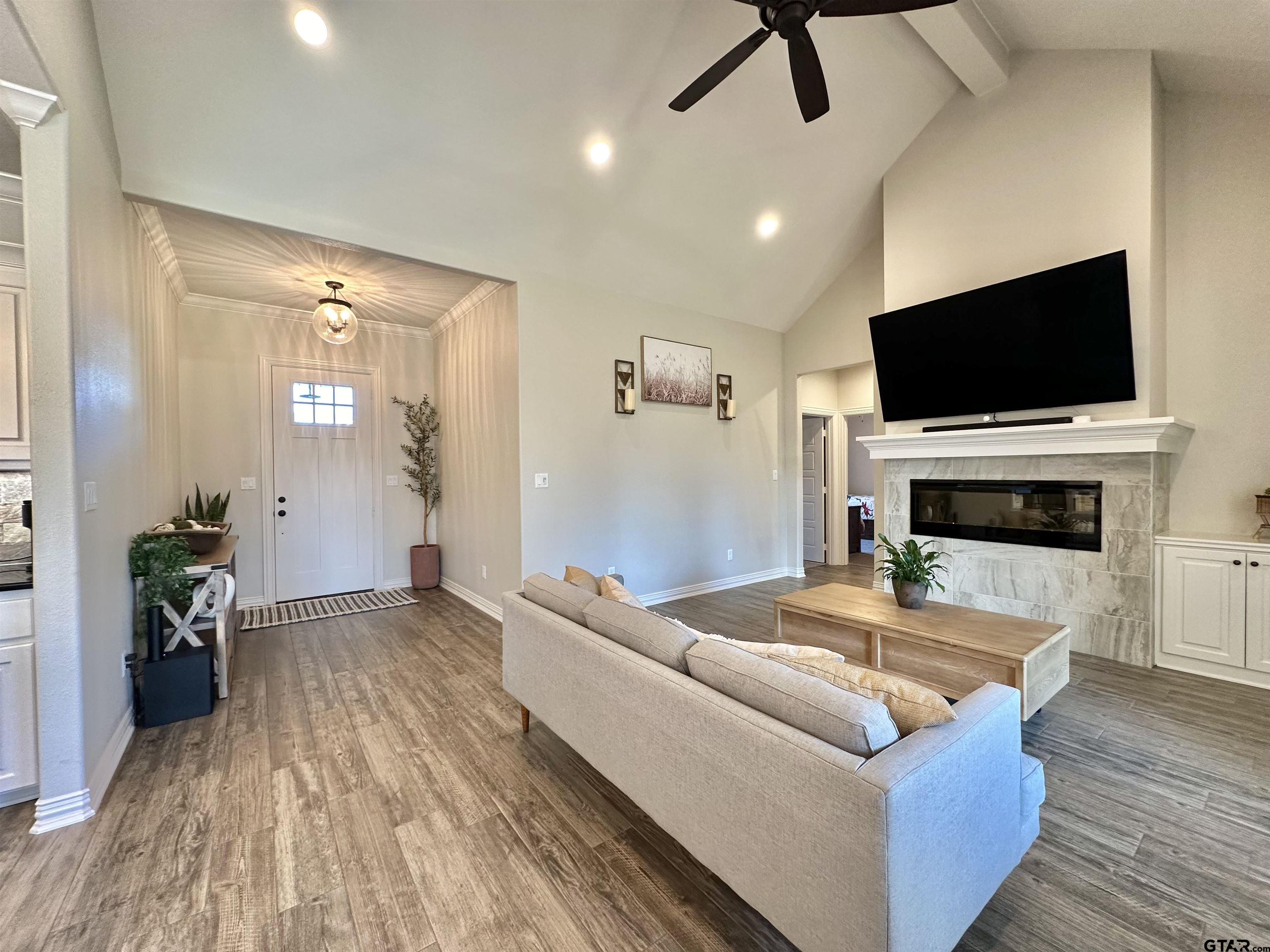 345 Willow Creek Ranch Road Gladewater, TX 75647 - Photo 10 of 47 a living room with furniture and a flat screen tv
