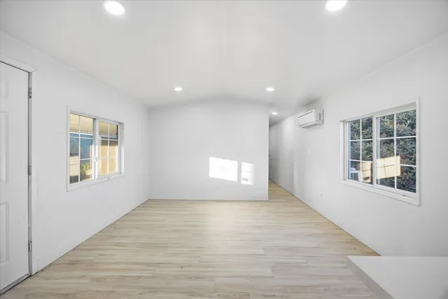 a view of empty room with windows