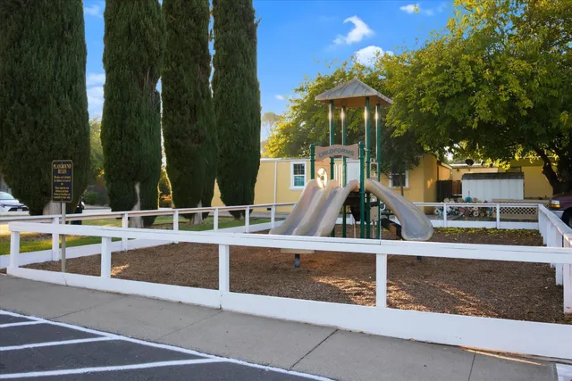 a view of a house with palm trees