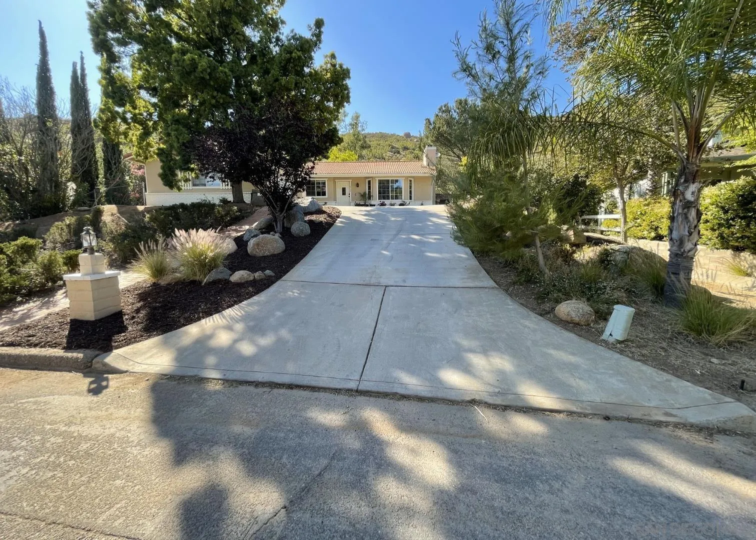 16734 Georgios Way Ramona, CA 92065 - Photo 1 of 35 a view of a yard with plants and trees