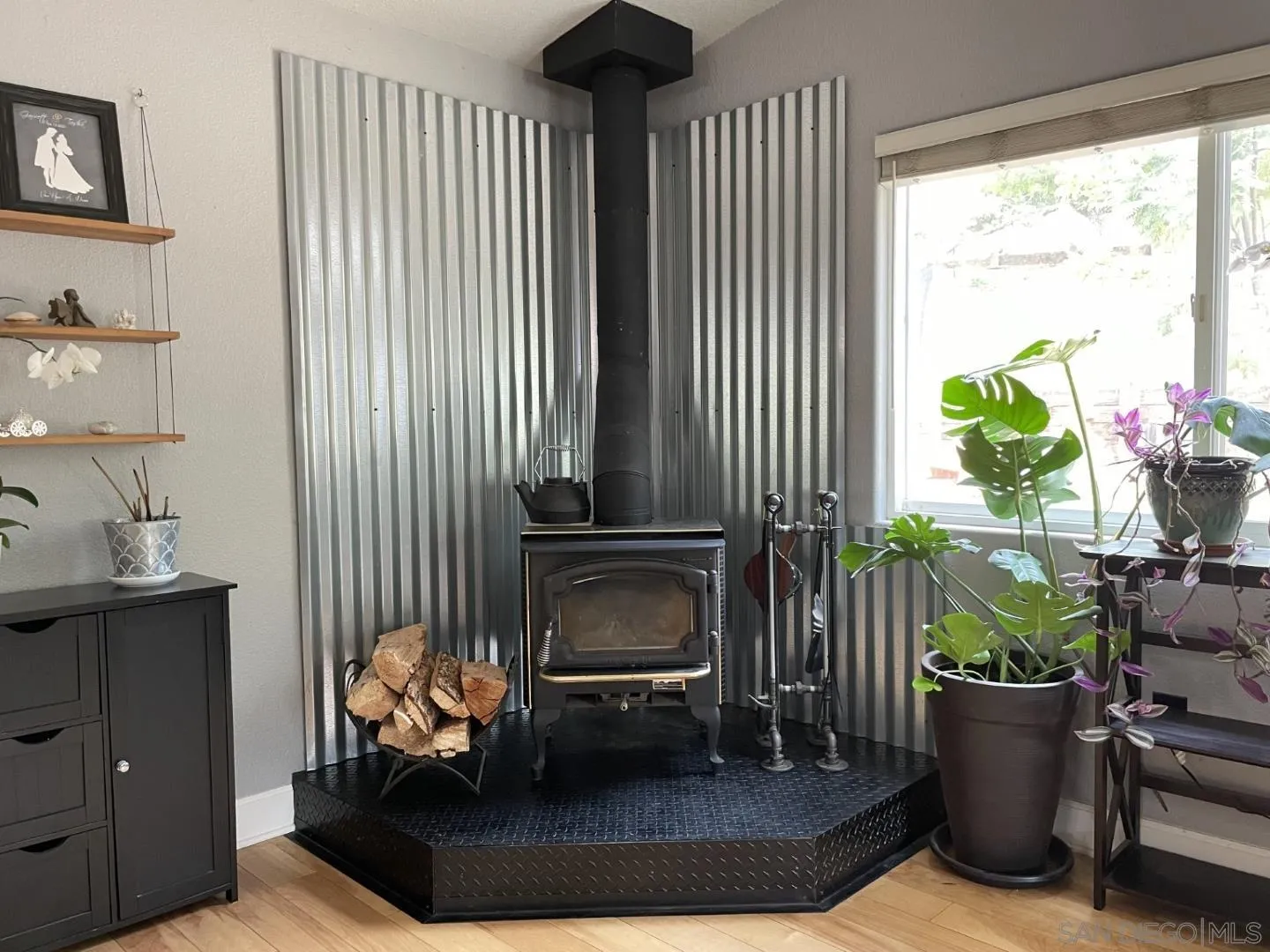 16734 Georgios Way Ramona, CA 92065 - Photo 16 of 35 a living room with furniture and a potted plant