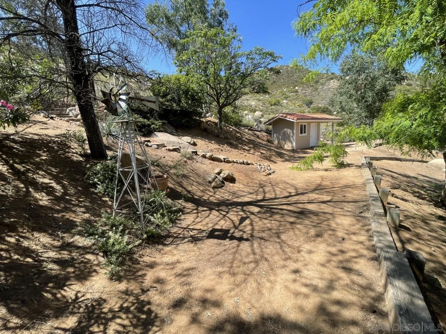 16734 Georgios Way Ramona, CA 92065 - Photo 19 of 35 a view of a yard with plants and trees