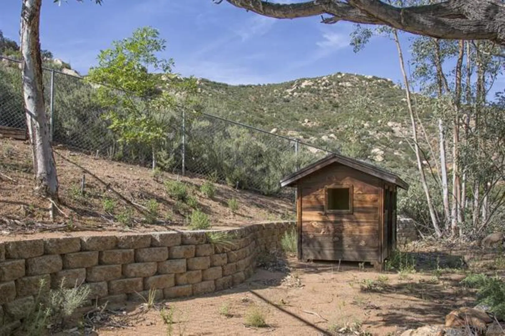 16734 Georgios Way Ramona, CA 92065 - Photo 22 of 35 a view of a house with a yard