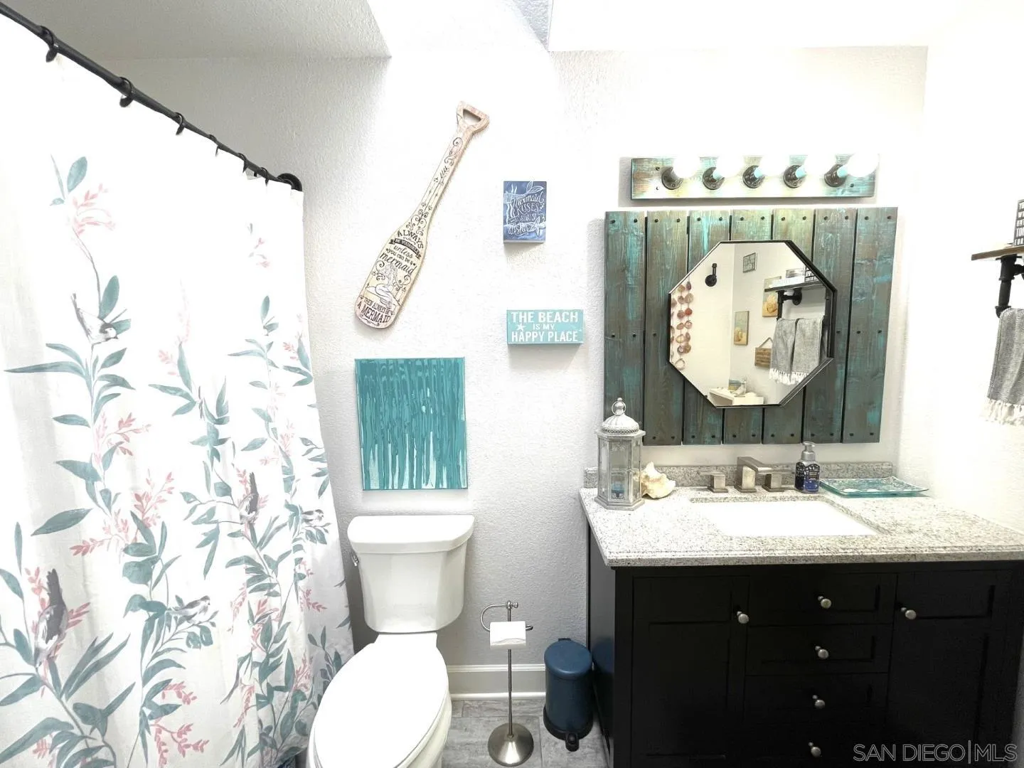 16734 Georgios Way Ramona, CA 92065 - Photo 27 of 35 a bathroom with a sink vanity mirror and toilet