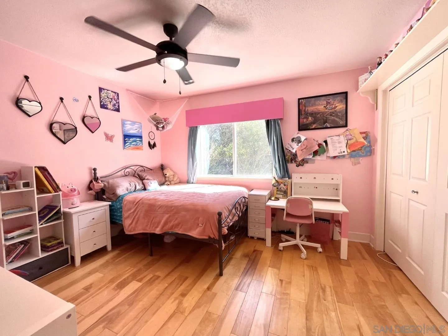 16734 Georgios Way Ramona, CA 92065 - Photo 28 of 35 a spacious bedroom with a bed and wooden floor