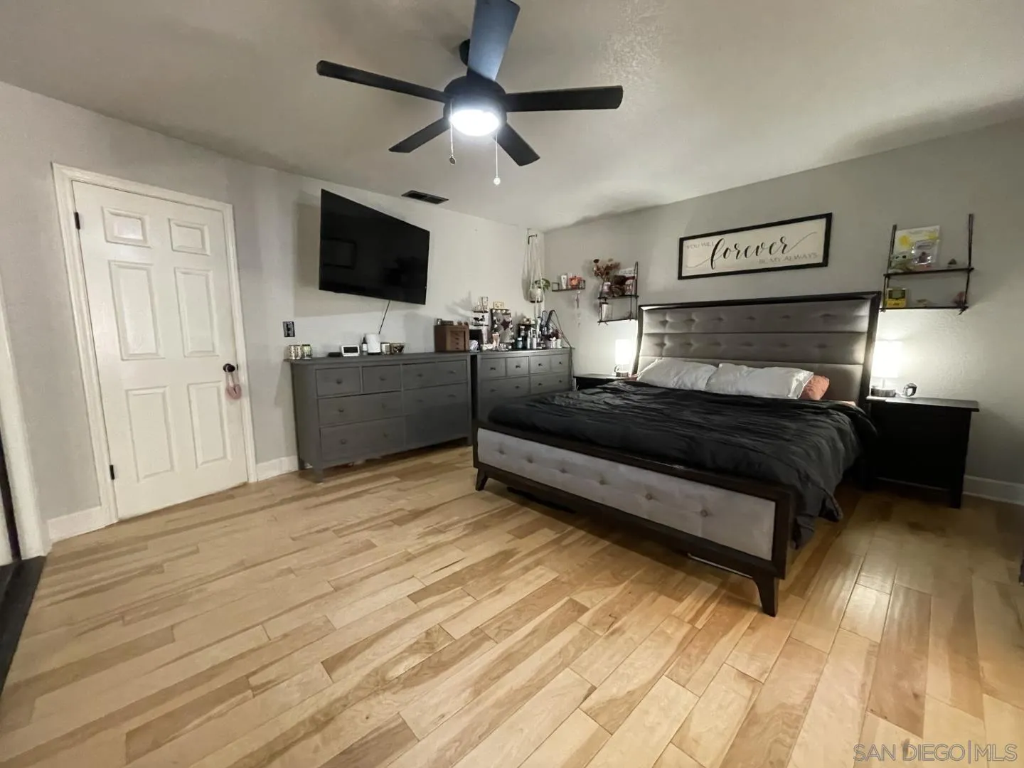 16734 Georgios Way Ramona, CA 92065 - Photo 30 of 35 a bedroom with a bed and a flat screen tv