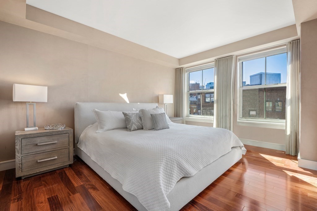 2 Battery Wharf, Unit 2503 Boston, MA 02109 - Photo 12 of 23 a bedroom with a bed and a large window
