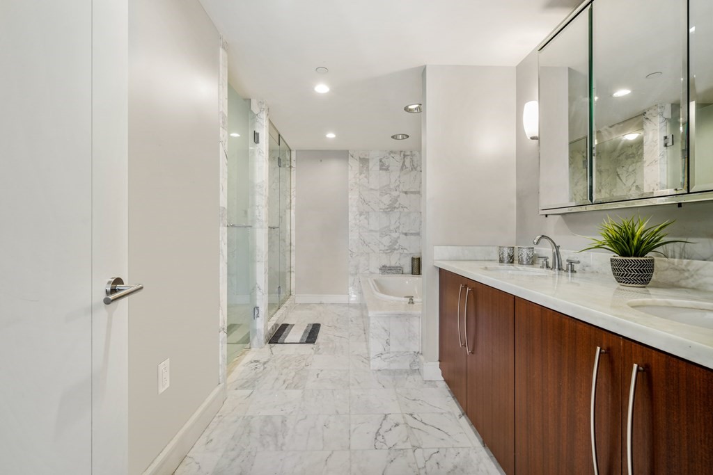 2 Battery Wharf, Unit 2503 Boston, MA 02109 - Photo 10 of 23 a bathroom with a double vanity sink toilet and shower