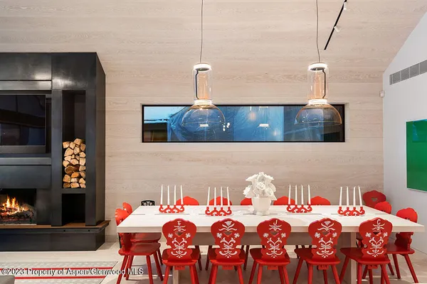 a front view of a house with a table and chairs