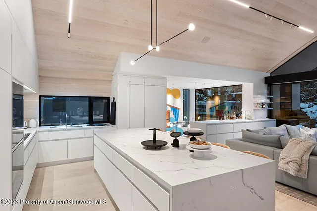 a kitchen with a sink appliances and cabinets