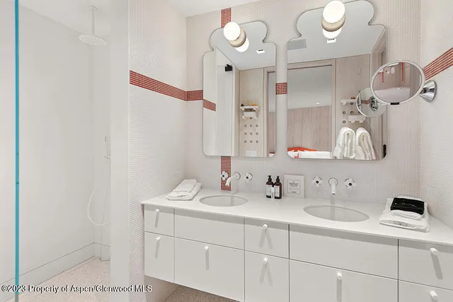 a bathroom with a sink vanity and a mirror